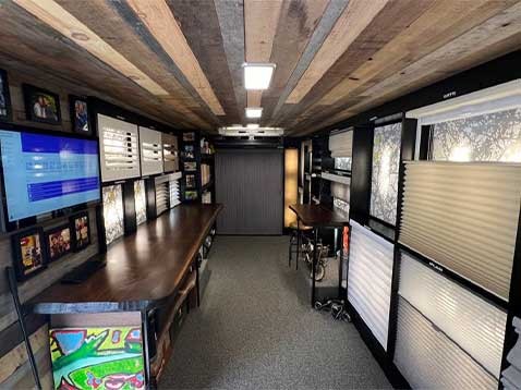 Store interior showcasing several different types of window coverings